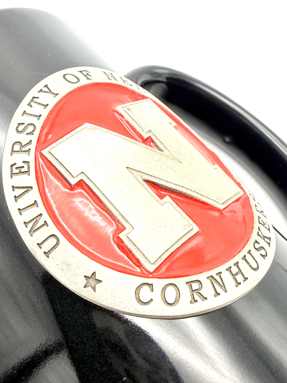Black Ceramic Mug with Metal Emblem Nebraska Cornhuskers
