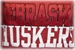 RED S/S V GLITTER NE HUSKERS AND N LOGO KINGSTON - AT-80103